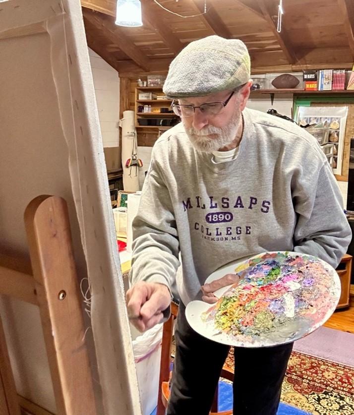 Man painting on canvas